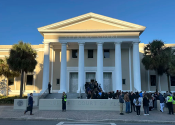 Earlier this year, people gathered outside the Florida Supreme Court in Tallahassee. Voting rights groups contesting the state's congressional map are relying on the court to restore a district that allowed Black voters in northern Florida the chance to elect their preferred candidate. (Brendan Farrington/AP)
