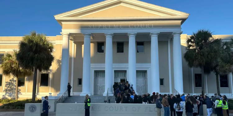 Earlier this year, people gathered outside the Florida Supreme Court in Tallahassee. Voting rights groups contesting the state's congressional map are relying on the court to restore a district that allowed Black voters in northern Florida the chance to elect their preferred candidate. (Brendan Farrington/AP)