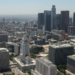 An aerial shot of the Los Angeles skyline, with the Los Angeles City Hall prominently visible in the foreground, captured on July 13, 2010. (Tom Szczerbowski/Getty Images)