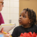 In January at Curlew Creek Elementary School, tutor Susan Cohen from the Read Across Pinellas program assists first grader Za’mir Maceachron with a reading lesson. The Pinellas County school district has launched similar initiatives aimed at closing the achievement gap among its students. [DOUGLAS R. CLIFFORD | Times]