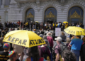 Attendees listen during a rally supporting reparations for African Americans outside San Francisco City Hall on Tuesday, September 19, 2023. While some advocates feel the initial effort to deliver reparations to Black Californians fell short of expectations, the final decision will rest with voters in November. (Eric Risberg/AP Photo)