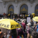 Attendees listen during a rally supporting reparations for African Americans outside San Francisco City Hall on Tuesday, September 19, 2023. While some advocates feel the initial effort to deliver reparations to Black Californians fell short of expectations, the final decision will rest with voters in November. (Eric Risberg/AP Photo)