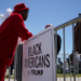 An attendee stands beside a "Black Americans for Trump" sign outside a community roundtable event featuring Republican presidential candidate and former U.S. President Donald Trump at 180 Church in Detroit, Michigan, on June 15, 2024. Photo by REUTERS/Brian Snyder. Purchase Licensing Rights.