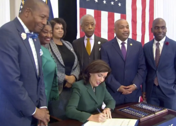 On December 19, 2023, New York Governor Kathy Hochul signed a bill establishing a commission to explore the possibility of slavery reparations. She was accompanied by Dr. Yohuru Williams of the University of St. Thomas' Racial Justice Initiative, NY State Senate Majority Leader Andrea Stewart-Cousins, Assemblywoman Michaelle Solages, Rev. Al Sharpton, NY State Assembly Speaker Carl Heastie, and State Senator James Sanders.