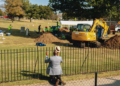 The Rev. Robert Turner of Vernon A.M.E. Church offered prayers at Oaklawn Cemetery after learning that scientists had discovered a mass grave during their excavation for victims of the 1921 Tulsa Race Massacre.
