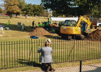 The Rev. Robert Turner of Vernon A.M.E. Church offered prayers at Oaklawn Cemetery after learning that scientists had discovered a mass grave during their excavation for victims of the 1921 Tulsa Race Massacre.