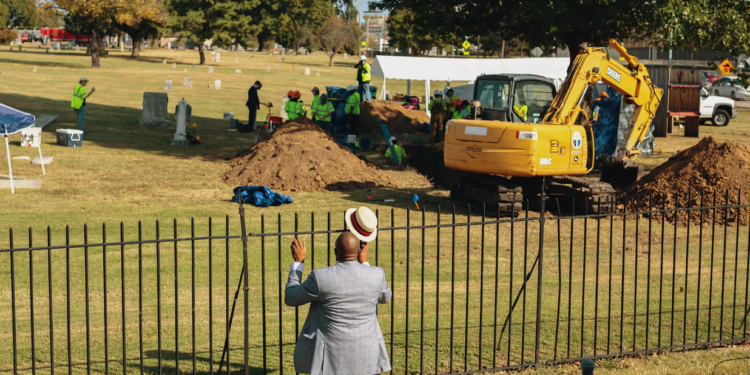 The Rev. Robert Turner of Vernon A.M.E. Church offered prayers at Oaklawn Cemetery after learning that scientists had discovered a mass grave during their excavation for victims of the 1921 Tulsa Race Massacre.