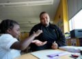 "On Thursday, Oct. 3, 2024, at Dorothy I. Height Elementary School in Baltimore, Leading Men fellow Davontez Johnson shares a high-five with preschooler Kodi during a name-writing activity. (AP Photo/Stephanie Scarbrough) The Associated Press"