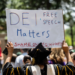 Protesters rally against DEI-related staff dismissals at UT Austin on April 29. Michael Minasi / KUT News