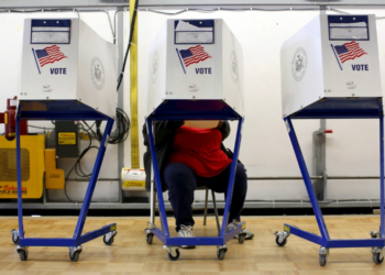 A person fills out a ballot at the polling center located at the James Weldon Johnson Community Center during the New York primary elections in East Harlem, New York City, on April 19, 2016. Photo by Andrew Kelly/Reuters.