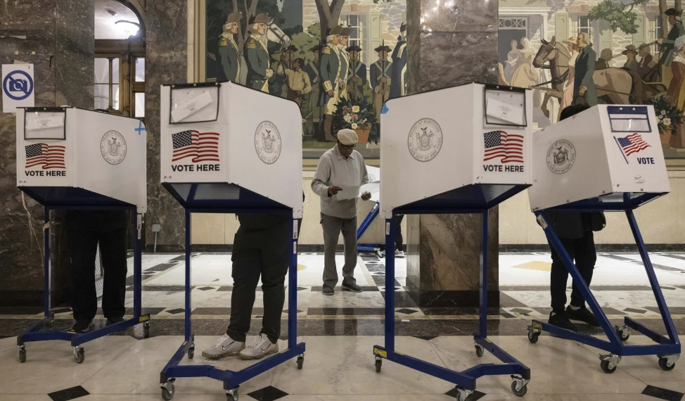 On Election Day, Tuesday, Nov. 5, 2024, voters cast their ballots at the Bronx County Supreme Court in New York. (AP Photo/Yuki Iwamura)
