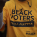 A person is spotted wearing a T-shirt that reads "Black Voters Still Matter." (Win McNamee/Getty Images)