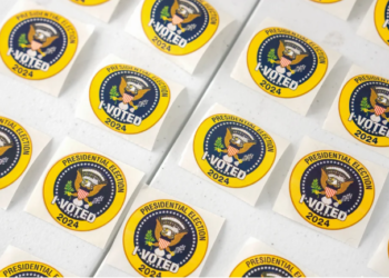 "I Voted" stickers are showcased at a polling station during early voting at the Ellen M. Bozeman Government Center in Arlington, Virginia, on Saturday, October 26, 2024. Photo credit: Kent Nishimura/Bloomberg/Getty Images.