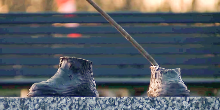 "In this video still provided by WXYZ, only the feet remain of a 600-pound bronze statue of a Tuskegee airman after it was stolen from a Detroit city park on Friday. (WXYZ via AP)"