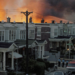 In this archival photo from May 13, 1985, flames engulf numerous row houses in West Philadelphia after police dropped a bomb on the MOVE organization's residence. (AP Photo, File)