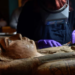 A conservator carefully cleans the 2,700-year-old sarcophagus of Ta-Kr-Hb. Photograph: Julie Howden
