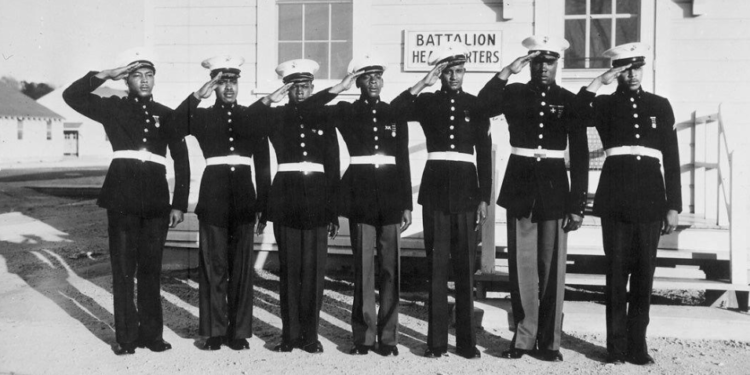 This image, taken from Fighting for the Right to Fight at the World War II Museum, shows Montford Point Marines saluting. Montford Point was the segregated Marine training camp established during World War II to train Black Marines. Photo courtesy of the World War II Museum.