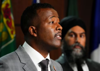 Nicholas Marcus Thompson, CEO of the Black Class Action Secretariat, addresses the media during a press conference on Parliament Hill in Ottawa, Wednesday, September 28, 2022. (Sean Kilpatrick/The Canadian Press)