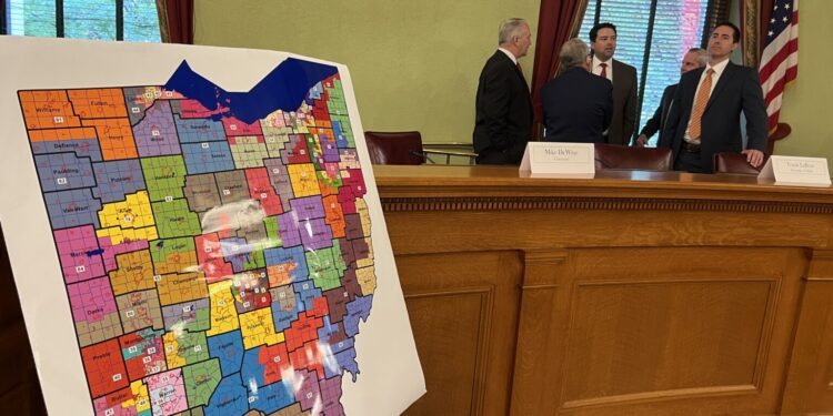 Republican members of the Ohio Redistricting Commission converse ahead of a 2023 public hearing on State House district maps. (Photo by Susan Tebben, Ohio Capital Journal.)