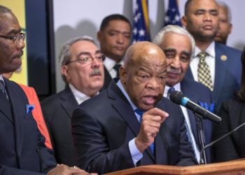Rep. John Lewis (D-Ga.) endorsed Hillary Clinton alongside the Congressional Black Caucus Political Action Committee on February 11, 2016. The endorsement event was captured in a photograph by J. Scott Applewhite for the Associated Press.