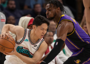 Los Angeles Lakers guard Bronny James (right) and Memphis Grizzlies guard Yuki Kawamura, from Japan, are pictured during the second half of an NBA basketball game in Memphis, Tennessee, on November 6. James made his return to basketball after experiencing a cardiac arrest during practice in July 2023. (Nikki Boertman/AP)
