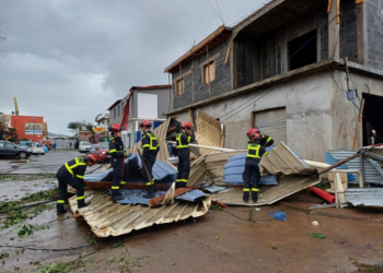 This photo, released on December 15, 2024, by Civil Security, shows rescue workers clearing debris in Mayotte, a French territory in the Indian Ocean, following the extensive destruction caused by Cyclone Chido. Reports indicate several fatalities. Credit: AP/UIISC7/Sécurité Civile