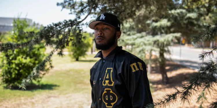Christopher Carter, a 22-year-old communications major in his fifth year at Cal State Northridge, poses for a portrait at CSUN in Northridge on August 19, 2022. "As a young Black man, I want to show the world that you can accomplish great things in life," Carter shared. "No matter the trials and tribulations, never give up."-Pablo Unzueta / CalMatters