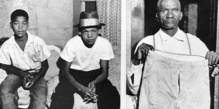 Simeon, 12, and Maurice Wright, 16, cousins of Emmett Till, sit at home following questioning about his disappearance. Moses Wright, 64, Emmett's great-uncle, holds up some of the boy’s clothing to illustrate that he was "large for his age." Photo: Bettmann Archive/Getty Images.