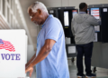 Black men casting their votes at election booths. (Photo illustration by Jack Forbes; images: Getty Images, Alex Wong/Getty Images) (Getty Images)