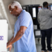 Black men casting their votes at election booths. (Photo illustration by Jack Forbes; images: Getty Images, Alex Wong/Getty Images) (Getty Images)