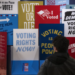 A visitor explores a voting rights exhibit at the International African American Museum in Charleston, South Carolina, January 2024. Jim Watson, AFP/Getty Images: