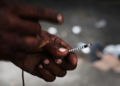 A heroin user in a South Bronx neighborhood grappling with a surge in drug use, particularly heroin and other opioid-based substances. Photo Credit: Spencer Platt/Getty Images