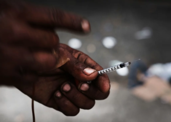 A heroin user in a South Bronx neighborhood grappling with a surge in drug use, particularly heroin and other opioid-based substances. Photo Credit: Spencer Platt/Getty Images