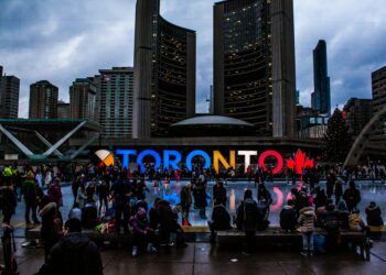 people gathered in front of toronto freestanding signage