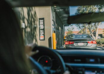 driver inside a car on a drive thru