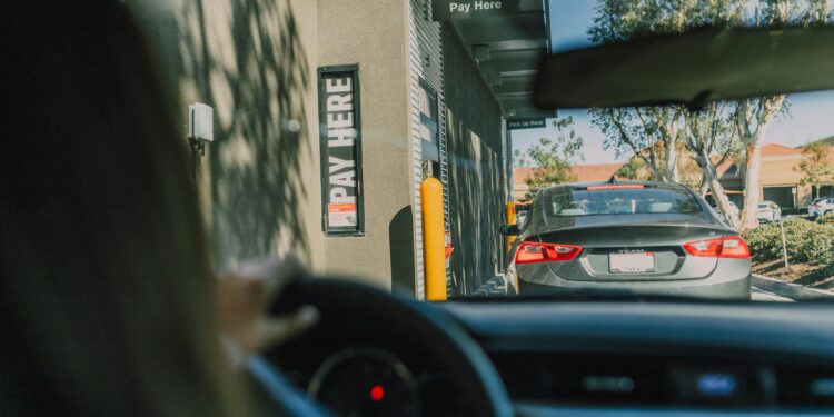 driver inside a car on a drive thru