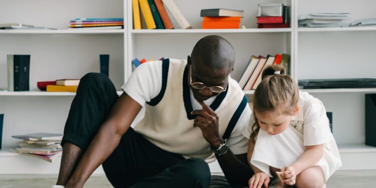 a man teaching a child