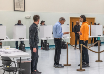 Voters queue at the Greater Mount Moriah Baptist Church polling station in Charlotte on November 5. Image Source: Grant Baldwin / AFP via Getty Images