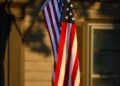 american flag in sunlight outside kansas home