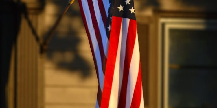 american flag in sunlight outside kansas home