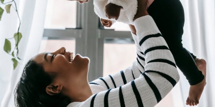 mother carrying her baby