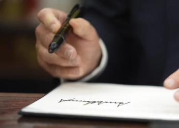 President Donald Trump signs executive orders in the Oval Office at the White House on Monday, January 20, 2025, in Washington, D.C. (AP Photo/Evan Vucci)