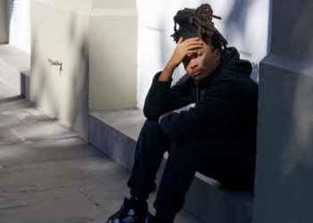 Trevant Hayes, 20, sits in the French Quarter grieving the loss of his friend, 18-year-old Nikyra Dedeaux, after a pickup truck plowed into pedestrians on Bourbon Street, followed by a shooting in New Orleans' French Quarter on Wednesday, January 1, 2025. (AP Photo/Matthew Hinton) – The Associated Press