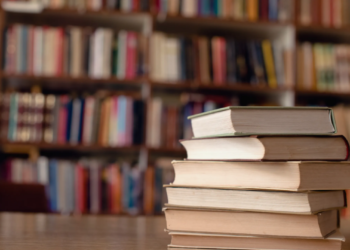 A close-up view of books on a desk in a library. (Getty Images)