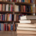 A close-up view of books on a desk in a library. (Getty Images)