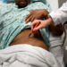 A doctor at Johns Hopkins Hospital labels the kidney to be removed from a living Black donor in this 2012 photo. Brendan Smialowski/AFP/Getty Images/File