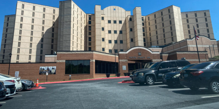 Vehicles are seen parked outside the Fulton County Jail in Atlanta on April 11, 2023. (AP Photo/Kate Brumback, File)