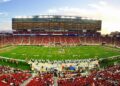 nfl stadium field full with crowd watching the game during daytime