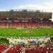 nfl stadium field full with crowd watching the game during daytime