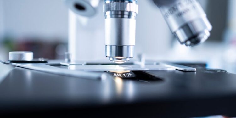 shallow focus photography of microscope